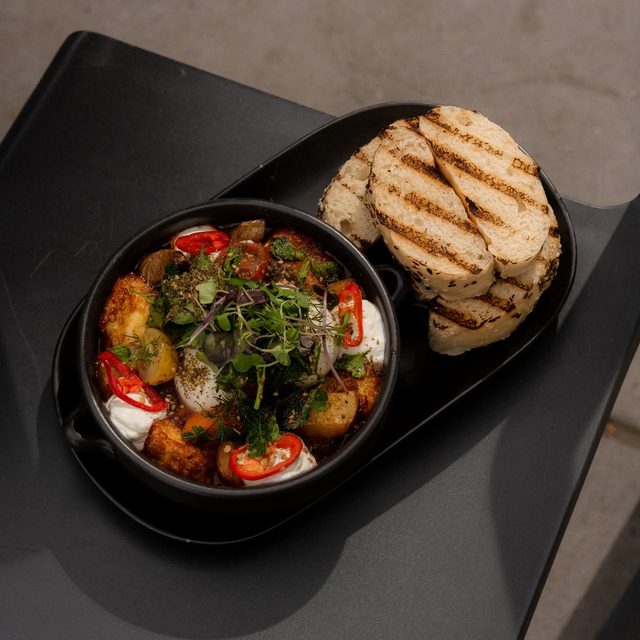 Red zhoug shakshuka with grilled bread